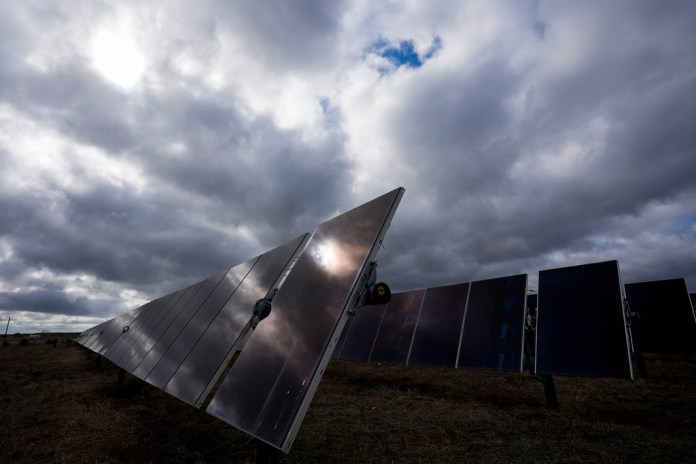The sun reflects off a solar panel on a solar farm owned by SB Energy on Tuesday, Dec. 17, 2024, in Buckholts, Texas. (AP Photo/Ashley Landis)