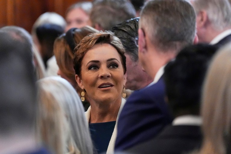 Kari Lake talks with Veterans Affairs Secretary Doug Collins before Irish Prime Minister Micheál Martin and President Donald Trump speak during an event in the East Room of the White House in Washington, Wednesday, March 12, 2025.