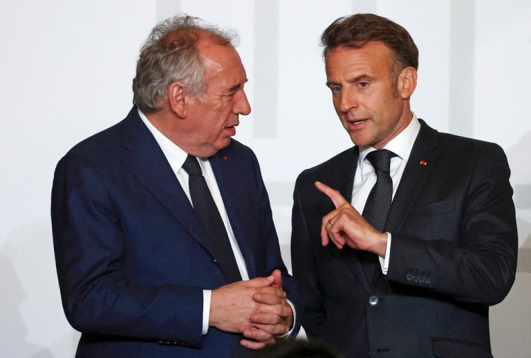 French President Emmanuel Macron, right, speaks with French Prime Minister François Bayrou during a collective awards ceremony in honor of those who contributed to the restoration of Notre-Dame Cathedral at the Elysee Palace in Paris, Tuesday, April 15, 2025.