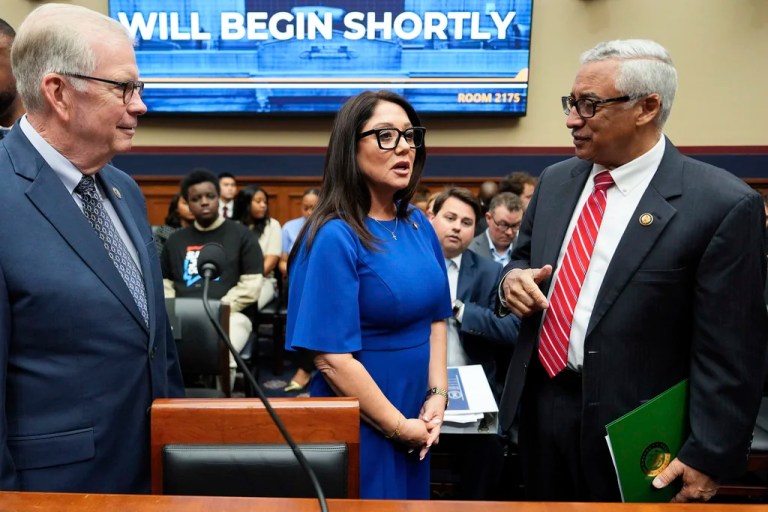 Secretary of Labor Lori Chavez-DeRemer speaks with Rep. Tim Walberg, R-Mich., left, and Rep. Bobby Scott, D-Va., right, before a House Education and Workforce hearing, Thursday, June 5, 2025, on Capitol Hill in Washington. (AP Photo/Julia Demaree Nikhinson)