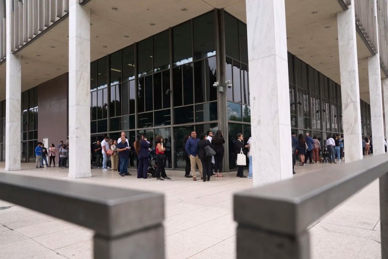 People line up outside the Los Angeles Federal Building in Los Angeles, housing the U.S. Immigration and Customs Enforcement and U.S. Citizenship and Immigration Services on Wednesday, June 25, 2025.