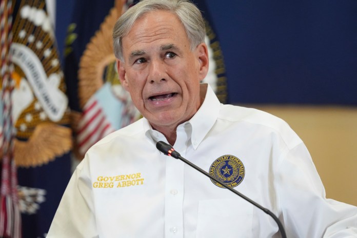 Texas Gov. Greg Abbott speaks during a roundtable discussion with President Donald Trump, first responders and local officials at Hill Country Youth Event Center in Kerrville, Texas, during a tour to observe flood damage, Friday, July 11, 2025.