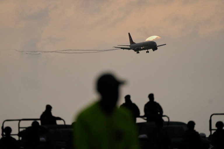 A plane carrying migrants deported months ago by the United States to El Salvador under the Trump administration's immigration crackdown lands at Simón Bolívar International Airport in Maiquetía, Venezuela, Friday, July 18, 2025.