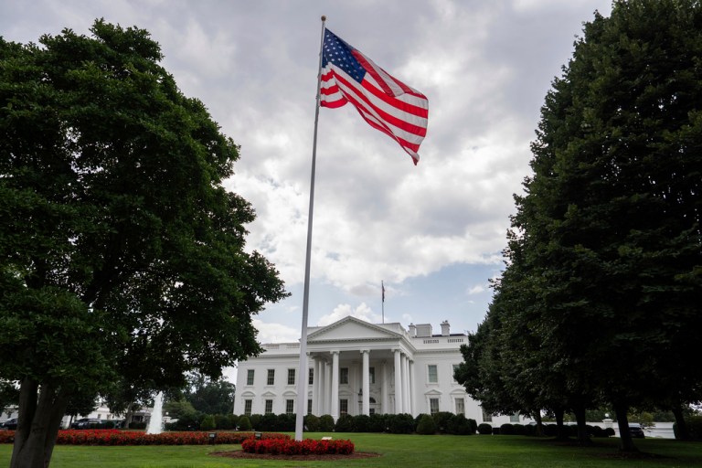 An American flag flies in front of the White House, Wednesday, July 23, 2025, in Washington. (AP Photo/Julia Demaree Nikhinson)