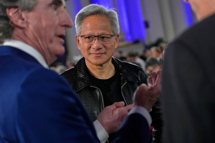 Nvidia CEO with Doug Burgum at AI summit in July.