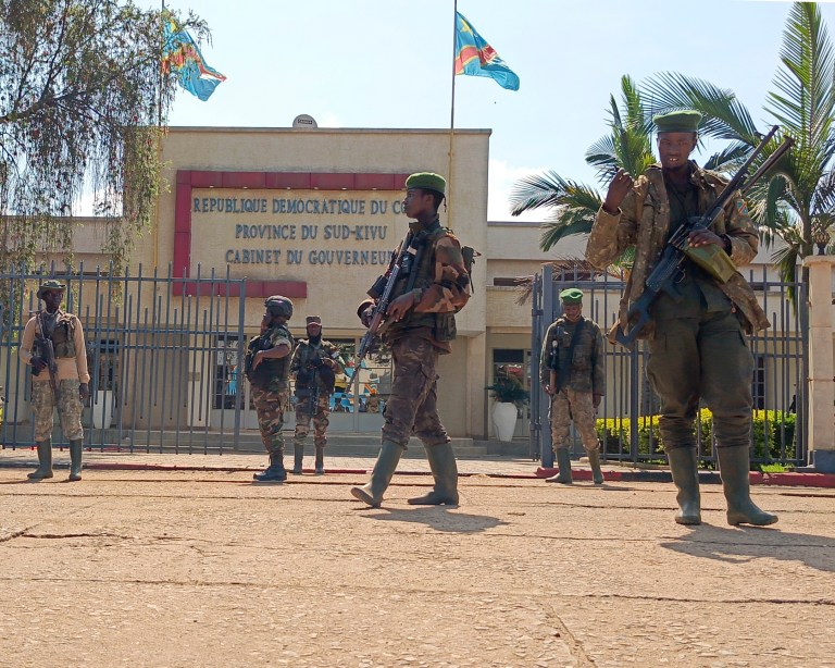 M23 rebels guard outside the South Kivu province administrative office, at the centre of east Congo's second-largest city, Bukavu, Sunday, Feb. 16, 2025. (AP Photo/Janvier Barhahiga , File)