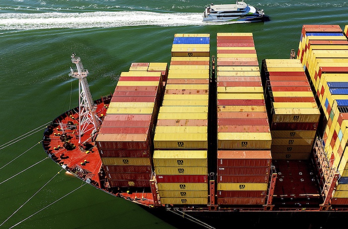 Cargo containers fill a ship at the Port of Oakland.