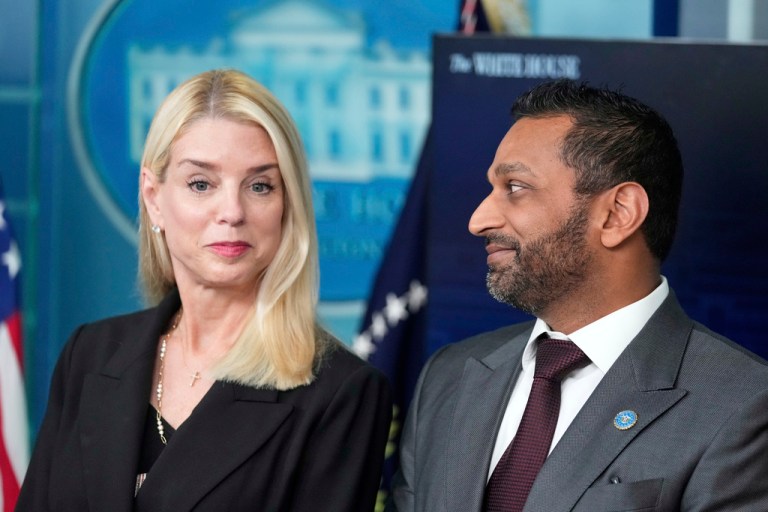 Attorney General Pam Bondi, left, and FBI Director Kash Patel listen as President Donald Trump speaks with reporters in the James Brady Press Briefing Room at the White House, Monday, Aug. 11, 2025, in Washington. (AP Photo/Mark Schiefelbein)