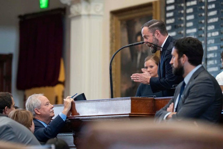 Speaker of the House Rep. Dustin Burrows, R-Lubbock, speaks to Rep. Richard Hayes (R-Hickory Creek) as The House of Representatives attempts to convene but cannot due to Texas Democrats breaking quorum at the Texas Capitol in Austin, Tuesday, Aug. 12, 2025. (Mikala Compton /Austin American-Statesman via AP)