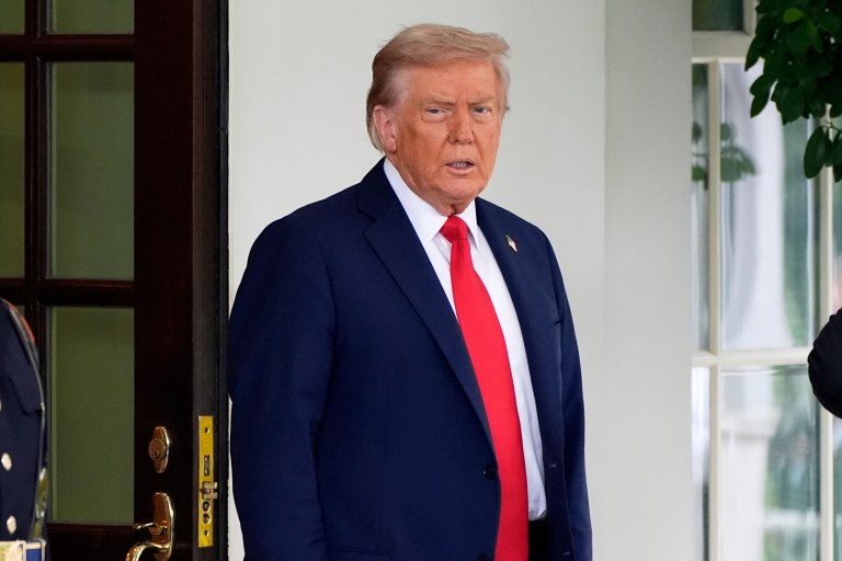 President Donald Trump stands before greeting Ukraine's President Volodymyr Zelenskyy as he arrives at the White House, Monday, Aug. 18, 2025, in Washington. (AP Photo/Alex Brandon)