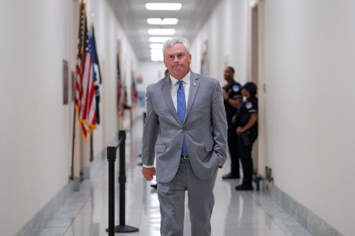House Oversight Committee Chairman James Comer (R-KY) walks down a hallway.
