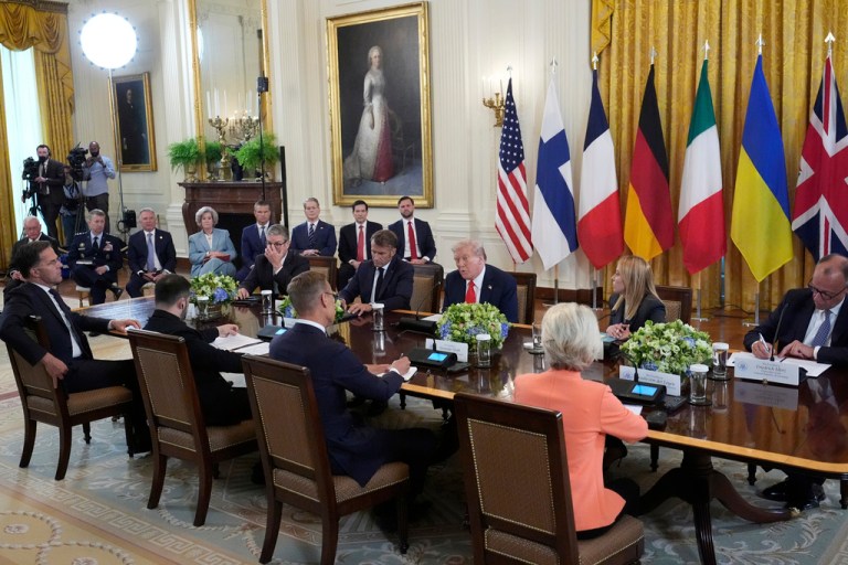 President Donald Trump, center, speaks as from foreground right, European Commission President Ursula von der Leyen, Finnish President Alexander Stubb, Ukrainian President Volodymyr Zelensky, NATO Secretary General Mark Rutte, and from center right, German Chancellor Friedrich Merz, Italian Prime Minister Giorgia Meloni, French President Emmanuel Macron and British Prime Minister Keir Starmer participate in a meeting as Vice President JD Vance, from background right, Secretary of State Marco Rubio, Treasury Secretary Scott Bessent, Defense Secretary Pete Hegseth, White House chief of staff Susie Wiles and special envoy Steve Witkoff listen in the East Room of the White House on Monday, Aug. 18, 2025, in Washington.
