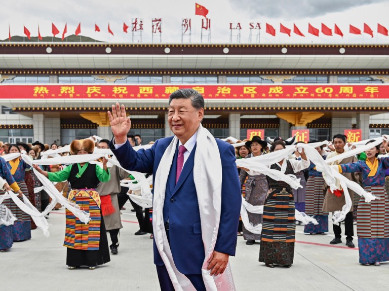 President Xi Jinping waves as he arrives at Lhasa in western China's Tibet Autonomous Region.