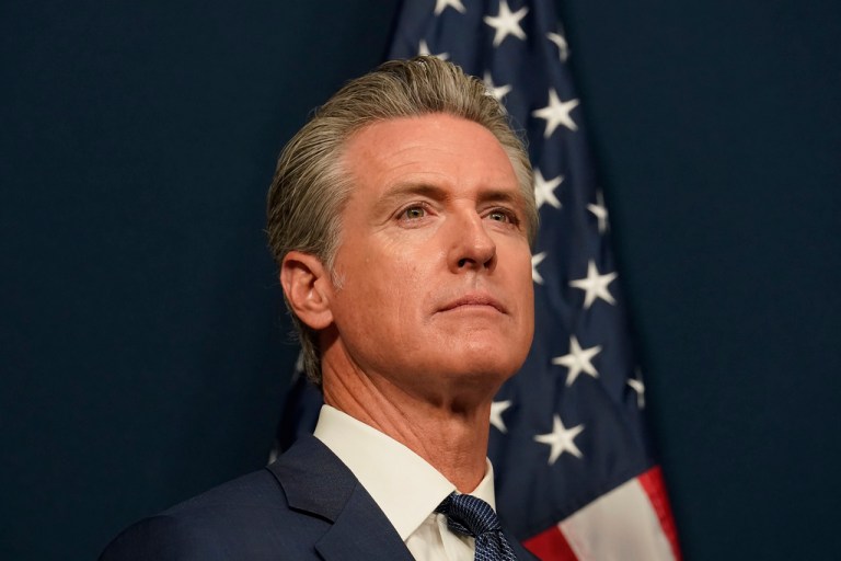 Gavin Newsom attends a press conference.