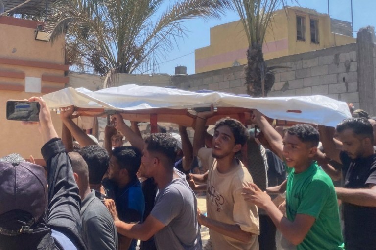 In this family handout photo, the body of freelance journalist Mariam Dagga, 33, is carried for burial after she was killed in a double Israeli strike on Nasser Hospital in Khan Younis, southern Gaza Strip, Monday, Aug. 25, 2025.