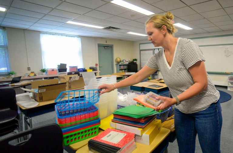 Logan Snow, a third-grade teacher at the Dummerston, Vt., School, gets supplies ready for students in her classroom.