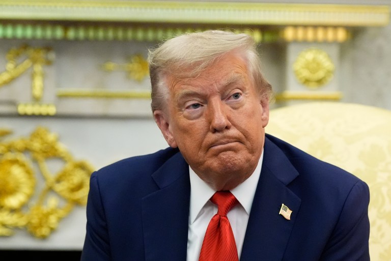 President Donald Trump listens during a meeting with South Korean President Lee Jae Myung.