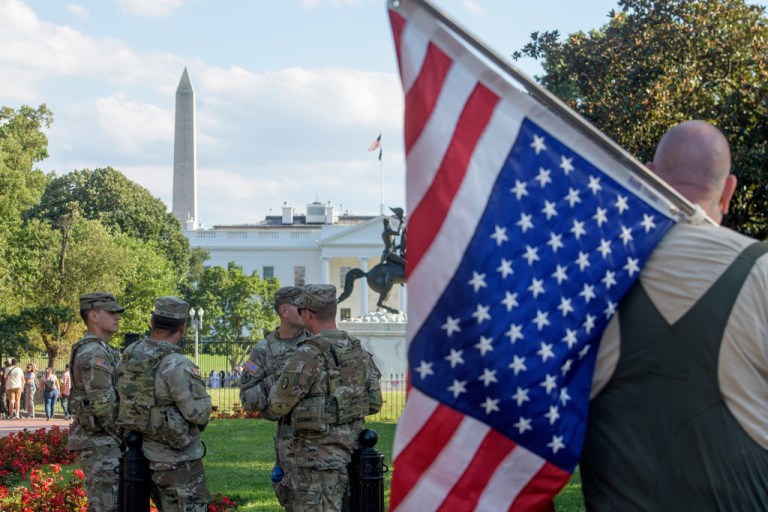 Man detained in flag burning incident near White House to protest Trump order
