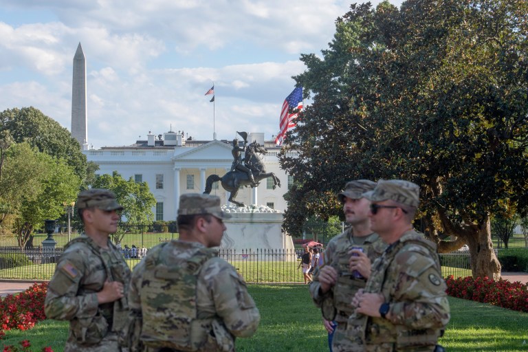 With the White House in the distance, members of the South Carolina National Guard patrol Lafayette Park on Monday, Aug. 25, 2025, in Washington.