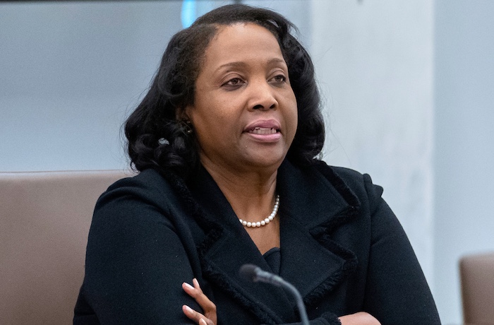 FILE - Federal Reserve Board of Governors member Lisa Cook listens during an open meeting of the Board of Governors at the Federal Reserve,