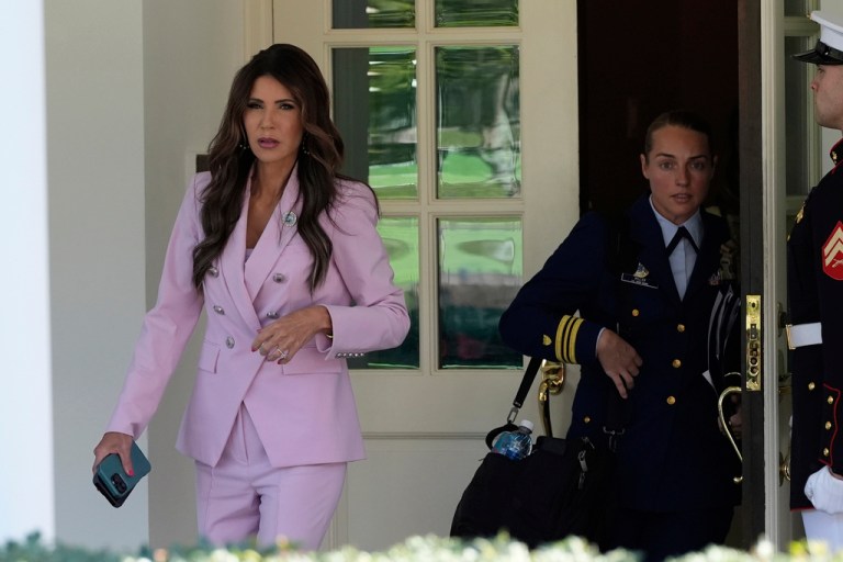 Homeland Security Secretary Kristi Noem walks from the West Wing of the White House, Tuesday, Aug. 26, 2025, in Washington, to do a television interview. (AP Photo/Alex Brandon)