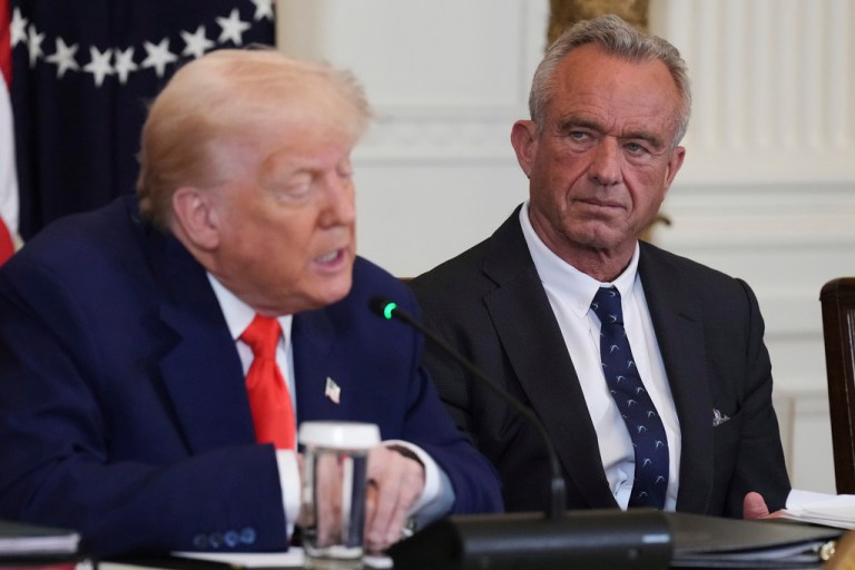 President Donald Trump, left, speaks as Health and Human Services Secretary Robert F. Kennedy Jr. listens.