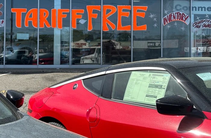 A dealership in Totowa, New Jersey tries to attract vehicle shoppers. (AP Photo/Ted Shaffrey)