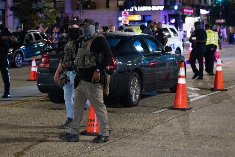 Federal law enforcement officers on Wednesday, August 13, 2025, at a checkpoint on 14th Street in Washington. President Donald Trump announced a federal takeover of the Metropolitan Police Department and the mobilization of the District of Columbia National Guard and other federal law enforcement, saying the move is necessary to restore order in the district.