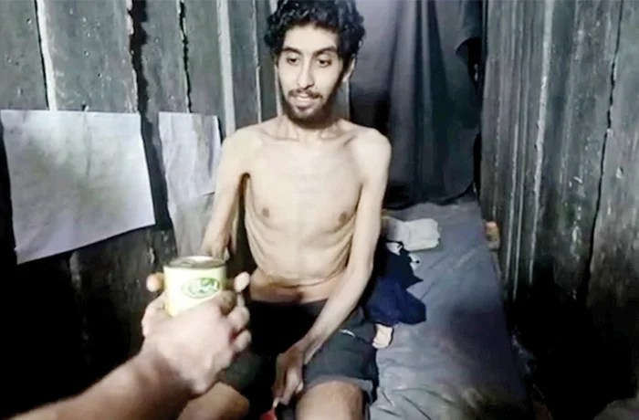 Emaciated Israeli hostage Evyatar David is offered a can of beans in a video released by Hamas, Aug. 2, 2025.
