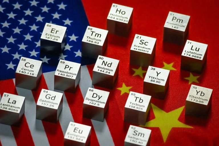 Metal cubes representing rare earth elements including Neodymium (Nd), Praseodymium (Pr), Dysprosium (Dy), Terbium (Tb), and othersare displayed with their symbols and atomic numbers on overlapping flags of the United States and China on July 26, 2025 in Chongqing, China. (Photo illustration by Cheng Xin/Getty Images)