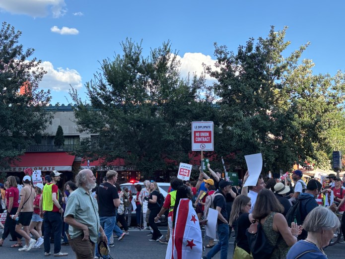 Protestors gather in front of Le Diplomate on Aug. 28 ahead of Labor Day weekend 2025. (Photo by Keely Bastow/Washington Examiner)