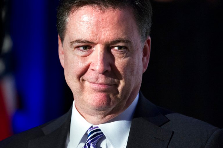 FBI Director James Comey smiles.