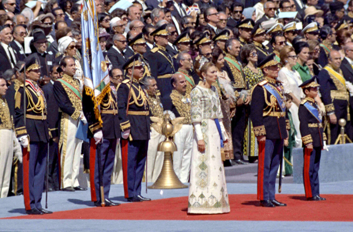 The Shah of Iran, second right, Crown Prince Riza, right, and Empress Farah, third right, watch the laying of a wreath laying ceremony at Pasargadae, Iran, Oct. 12, 1971. (AP Photo)