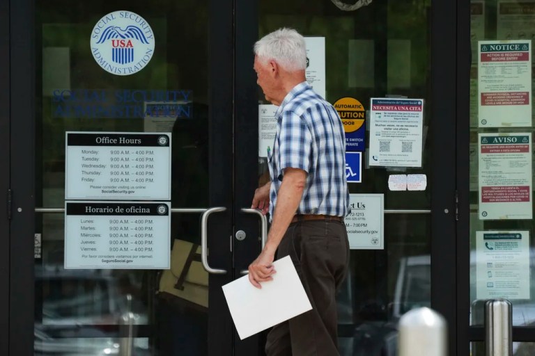 A man walks to a U.S. Social Security Administration office Monday, June 30, 2025, in Mount Prospect, Ill. (AP Photo/Nam Y. Huh)