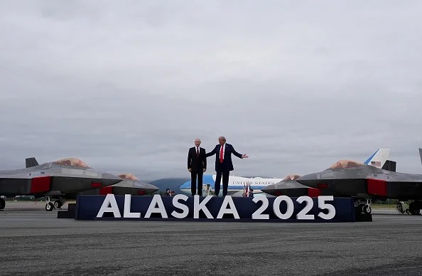 ANCHORAGE, ALASKA - AUGUST 15: U.S. President Donald Trump (R) welcomes Russian President Vladimir Putin as they arrives at Joint Base Elmendorf-Richardson on August 15, 2025 in Anchorage, Alaska. The two leaders are meeting for peace talks aimed at ending the war in Ukraine. (Photo by Andrew Harnik/Getty Images)