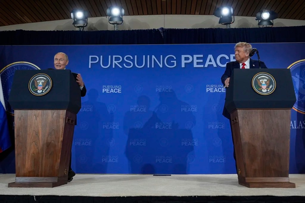 President Donald Trump and Russia's President Vladimir Putin speak during a news conference at Joint Base Elmendorf-Richardson, Alaska, Friday, Aug. 15, 2025. (AP Photo/Julia Demaree Nikhinson)