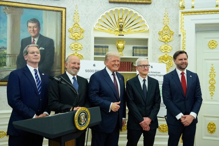 From left, Treasury Secretary Scott Bessent, Commerce Secretary Howard Lutnick, President Donald Trump, Apple CEO Tim Cook and Vice President JD Vance, pose for a photo after President Trump made an announcement about Apple, in the Oval Office, Wednesday, Aug. 6, 2025, in Washington.