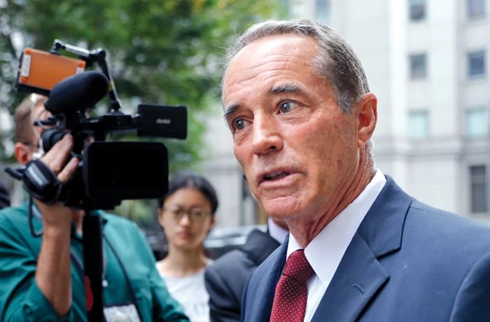 Then-Rep. Chris Collins (R-NY) speaks to reporters as he leaves the courthouse after a pretrial hearing in his insider-trading case in New York, on Sept. 12, 2019. (Seth Wenig/AP)