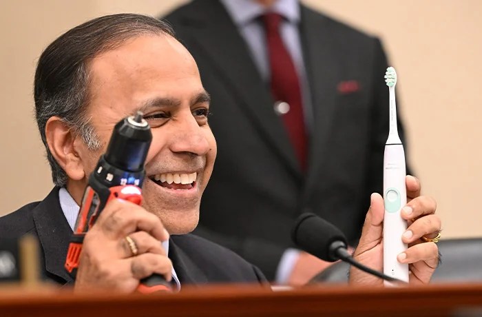 At a recent hearing, Rep. Raja Krishnamoorthi (D-IL) shows everyday items containing rare earth exports in the form of magnets used in their circuitry. (Mattie Neretin/CNP via Newscom)