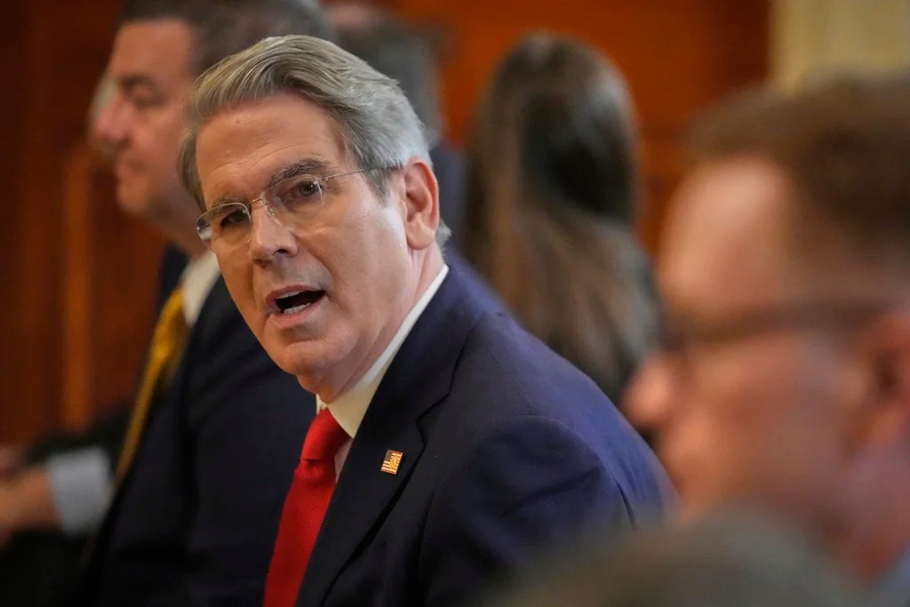 Treasury Secretary Scott Bessent arrives before President Donald Trump speaks at an event to promote his proposal to improve Americans' access to their medical records in the East Room of the White House, Wednesday, July 30, 2025, in Washington.