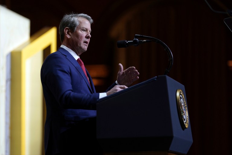 Gov. Brian Kemp (R-GA) speaks before President Donald Trump at a Republican Governors Association meeting.