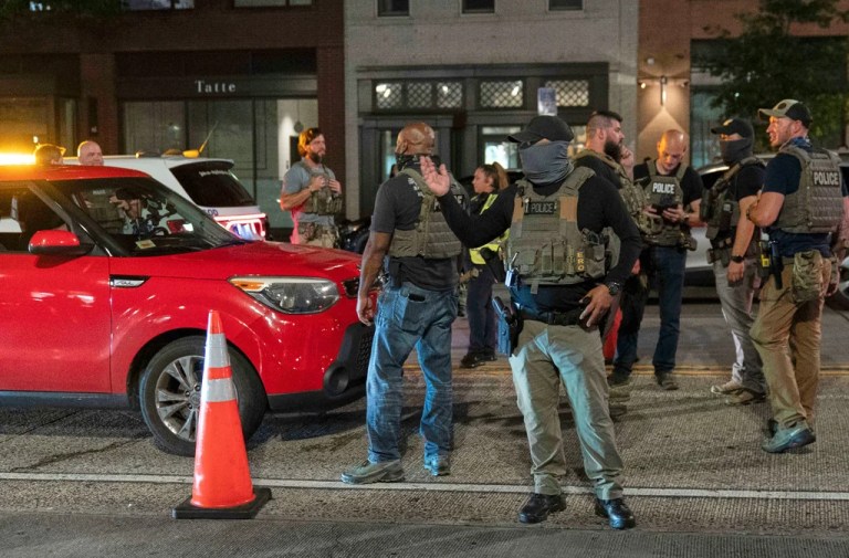 Immigration and Customs Enforcement's Homeland Security Investigations agents join Washington Metropolitan Police Department officers as they conduct traffic checks at a checkpoint along 14th Street in northwest Washington, Wednesday, Aug. 13, 2025, in Washington.
