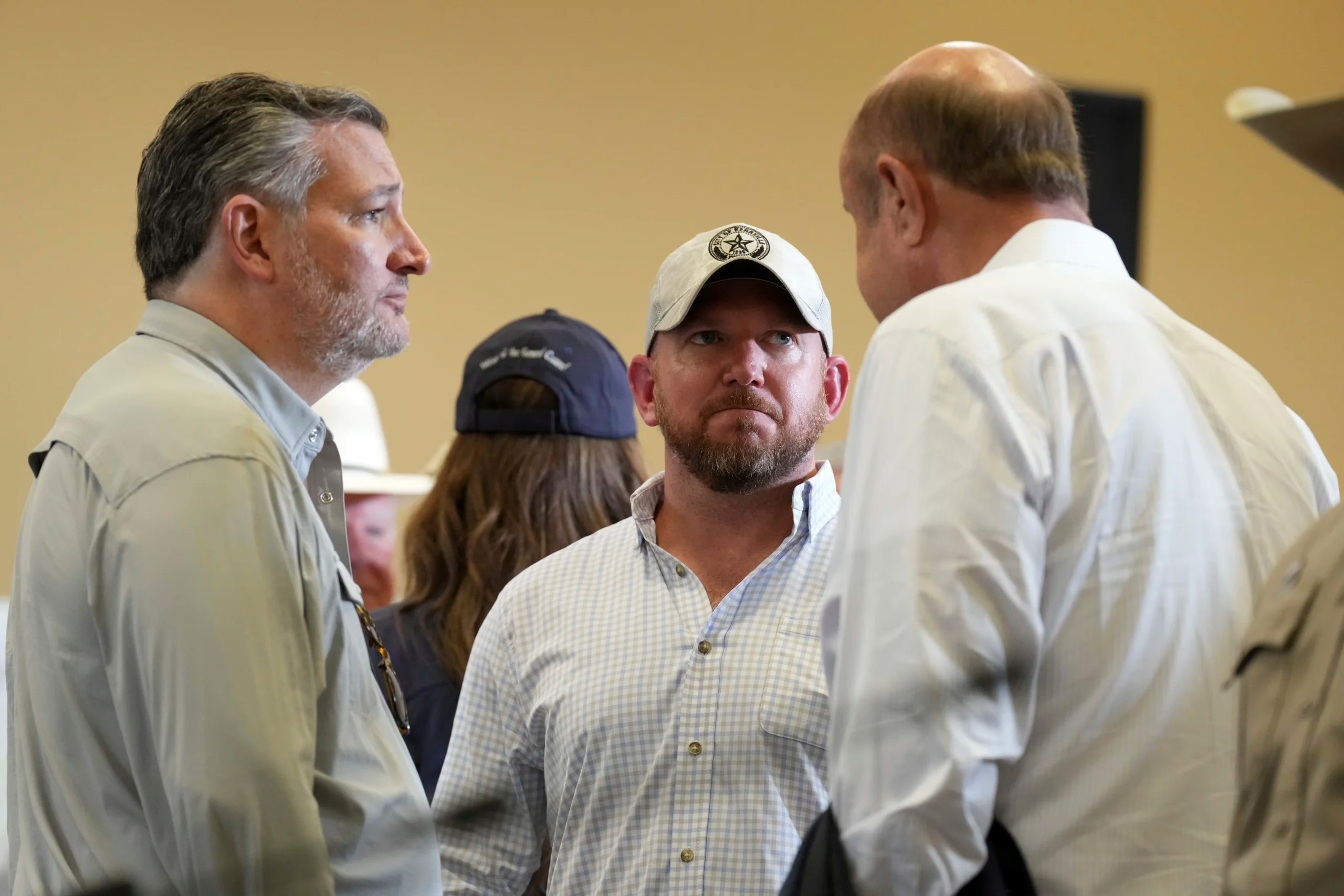 Sen. Ted Cruz, R-Texas, from left, speaks with Kerrville,Texas City Manager Dalton Rice and Phil McGraw before President Donald Trump arrives to speak during a roundtable discussion with first responders and local officials at Hill Country Youth Event Center in Kerrville, during a tour to observe flood damage, Friday, July 11, 2025.