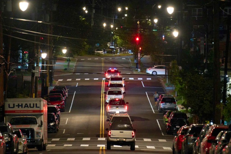 Vehicles with law enforcement agents from the U.S. Customs and Border Protection as well as Metropolitan Police drive along Kennedy Street NW, in the early morning of Wednesday, Aug. 13, 2025, in Petworth neighborhood of Washington. (AP Photo/Jacquelyn Martin)