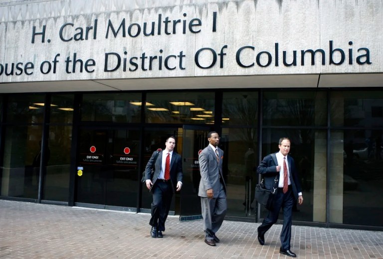 Former Washington Wizards' guard Javaris Crittenton, center, leaves with his attorneys D.C. Superior Court in Washington on Jan. 25, 2010.(AP Photo/Jose Luis Magana)