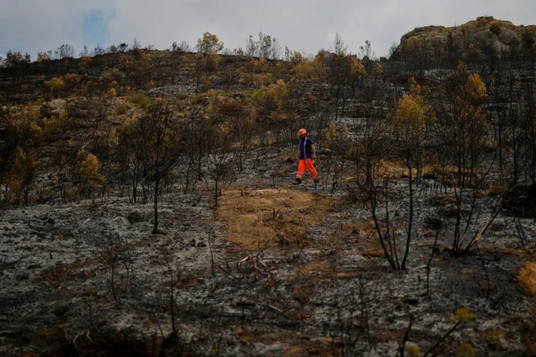 Firefighters battle to prevent reignition of France’s largest wildfire as residents return home