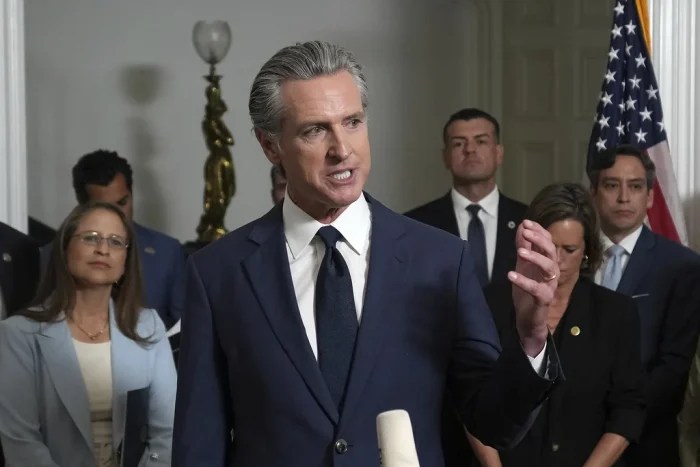 Accompanied by California and Texas lawmakers, California Gov. Gavin Newsom speaks in support of the Texas Democratic lawmakers for their walk out to block a vote on a congressional redistricting plan sought by President Donald Trump, during a news conference in Sacramento, Calif., Friday Aug. 8, 2025. (AP Photo/Rich Pedroncelli)