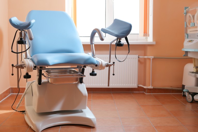 Maternity chair in the surgical obstetric ward. Chair for inspection of pregnant women. Inspection room in the hospital.