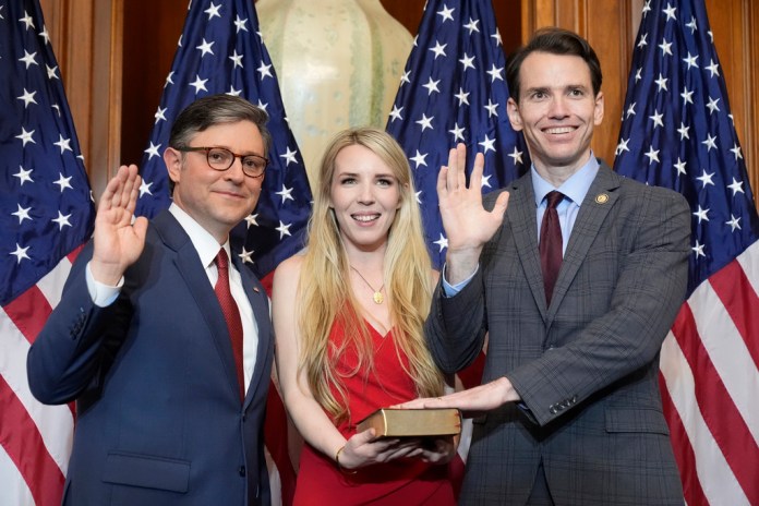 House Speaker Mike Johnson (R-LA), left, poses during a ceremonial swearing-in with Rep. Kevin Kiley (R-CA) in the Rayburn Room at the Capitol in Washington, D.C., Friday, Jan. 3, 2025.