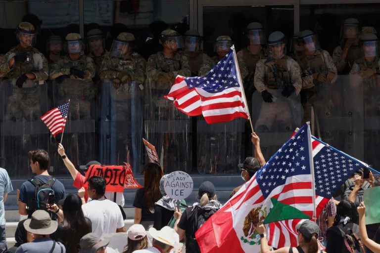 Protesters confront Marines and National Guard outside the Federal Building on Friday, July 4, 2025 in Los Angeles. (AP Photo/Jill Connelly)